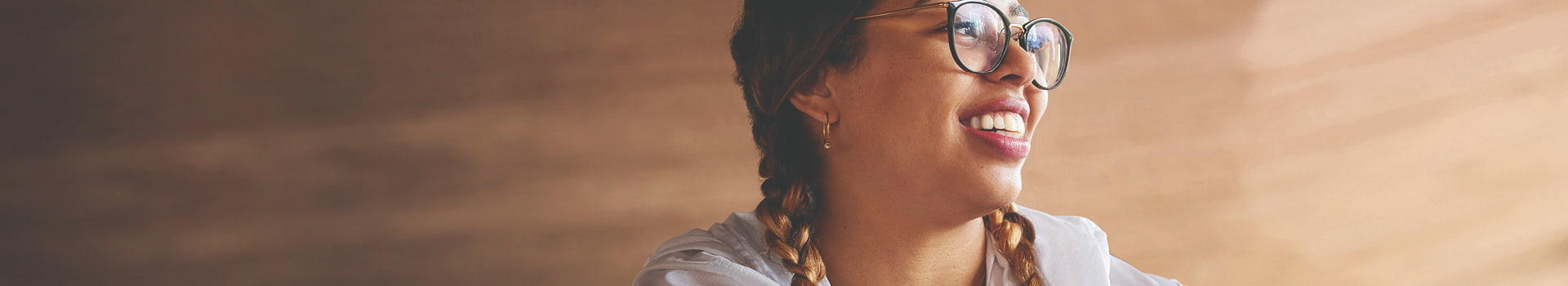 Person in braids smiling.