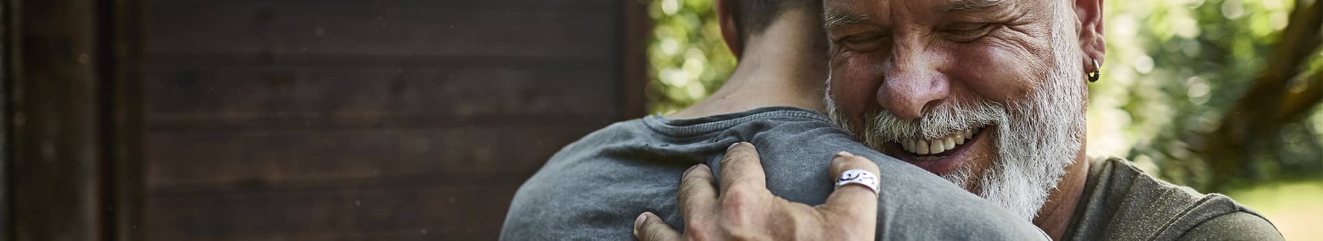 Close-up of two people hugging