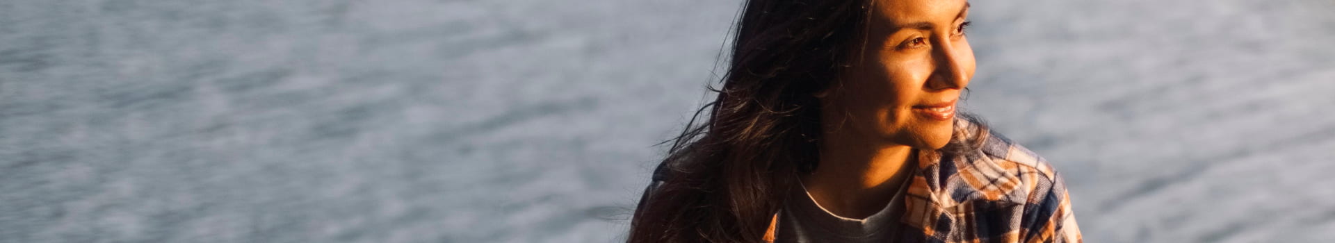 Person with lake in background