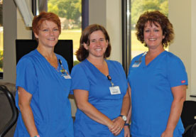Though her treatment ended in 2011, Diane Gerhardt (top left) continues to visit the staff who administered her chemotherapy, including registered nurse Darla Lytle. “I want them to know they’ve made a difference,” says Gerhardt. In addition to Lytle, nurses, from left, Brenda Jones, Britney Kawecki and Carolyn Jahnz are among the many staff members who care for patients receiving treatment.
