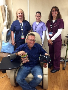 Steve Hofstede looks forward to showing off his new Wilson chemotherapy bag (left), compliments of his nurses at Mayo Clinic Health System – Northland in Barron, including Gaylene Monson, Tammy Loos-Skarpness and Stacy Cole. They invited medical lab technician Alicia Bourget (not pictured) to help design the gift.