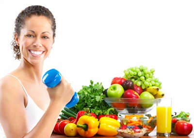 Woman with hand weight next to healthy food
