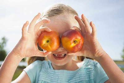 Child Holding Apples
