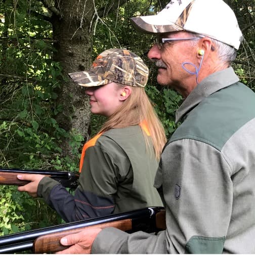 Two people hunting with guns