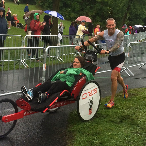 Jacob Nash, post-back surgery at Mayo Clinic Health System in Eau Claire, pushed a friend in a wheelchair through a 5-mile run.