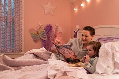 Lindsey Bruns with Daughter in Bed