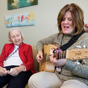 Angela Joan Adkins has unspecified dementia. Her music therapist, Roxie Raykovich, part of the Hospice team,  took a unique approach to bring back special memories by playing a song written by Joan's son, Guy, who passed away after a battle with cancer.