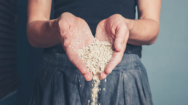 Hands holding oats