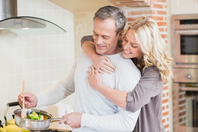 Man cooking healthy meal with woman