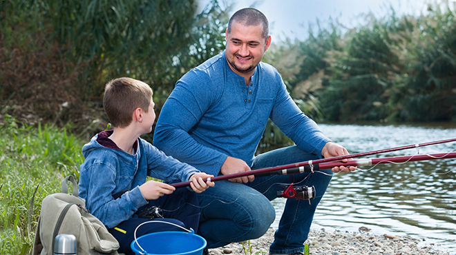Man fishing with boy