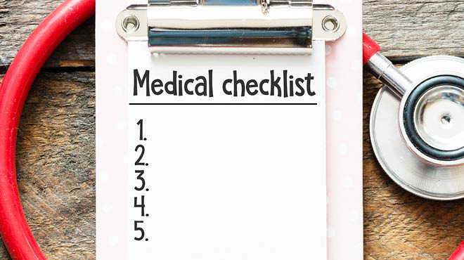 Medical checklist on clipboard and stethoscope