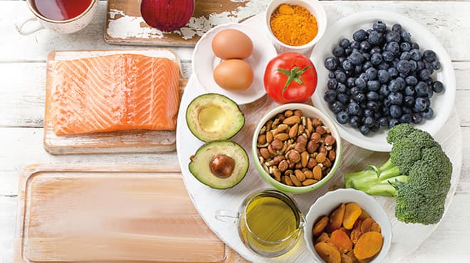 Healthy foods: Salmon, eggs, nuts, avocado, broccoli, blueberries