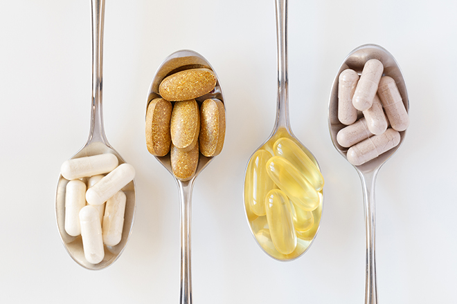 supplement-pills-on-spoons