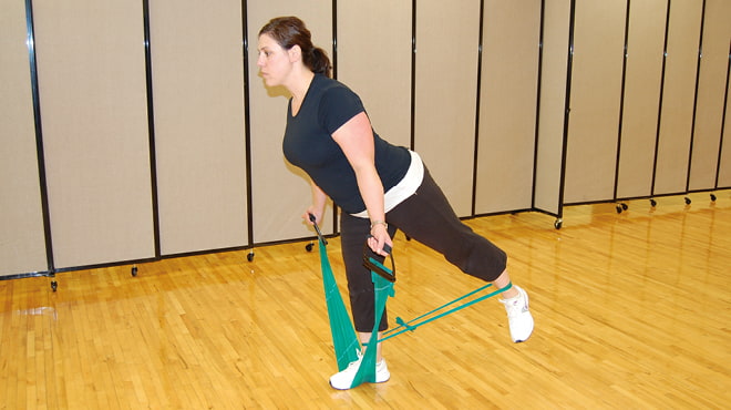 Woman using resistance bands