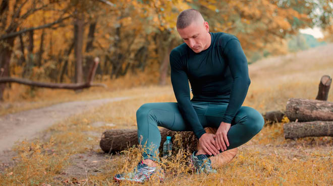 Male athlete with ankle leg pain