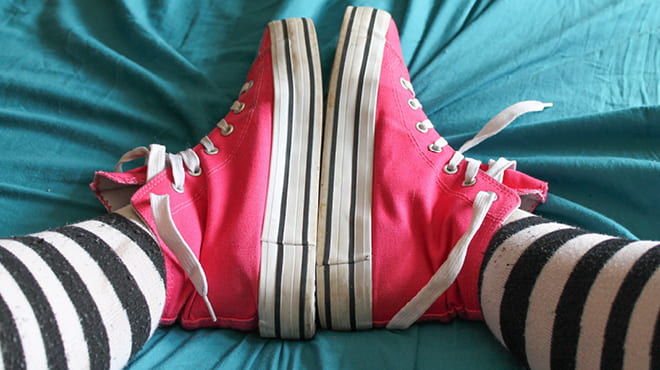 Pink Keds and striped stockings