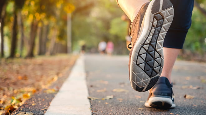 Running shoes on paved trail