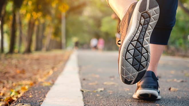 Running shoes on paved trail