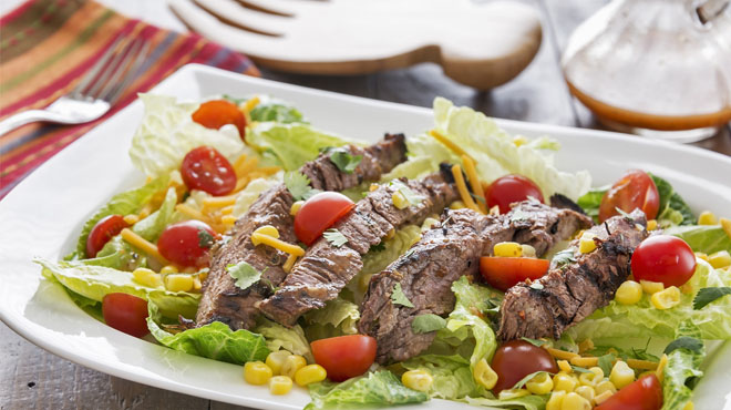 Salad with steak corn and tomatoes