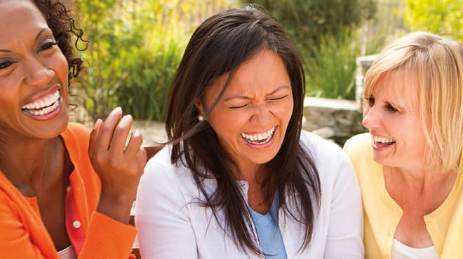 Three women laughing