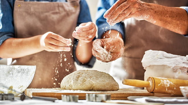 Two people making bread