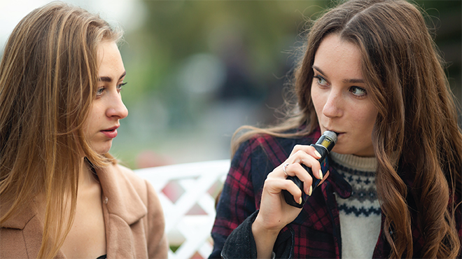 Two teen girls vaping