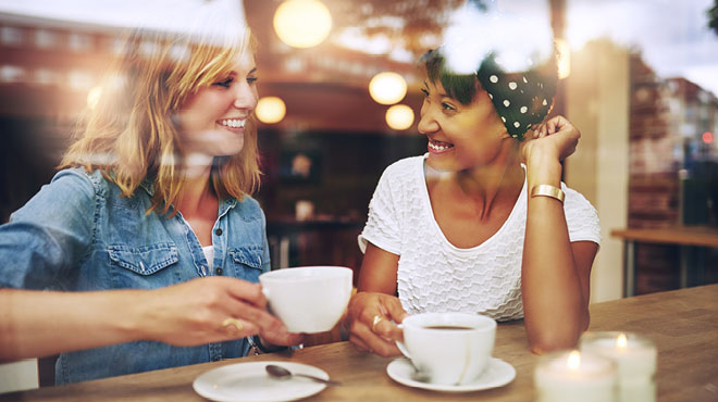Two women enjoying a cup of coffee