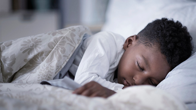 Child sleeping in bed