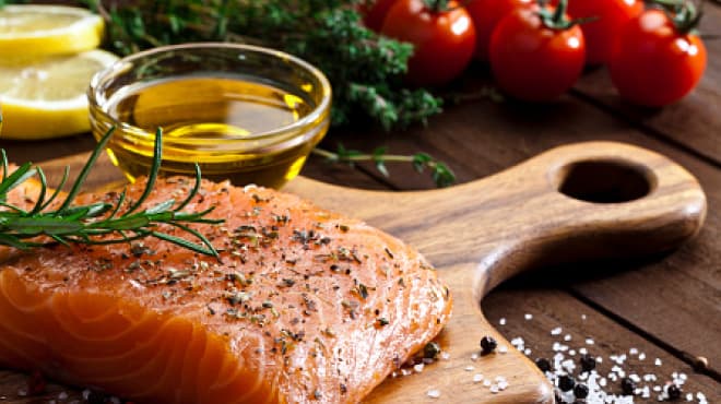 Salmon on wood cutting board