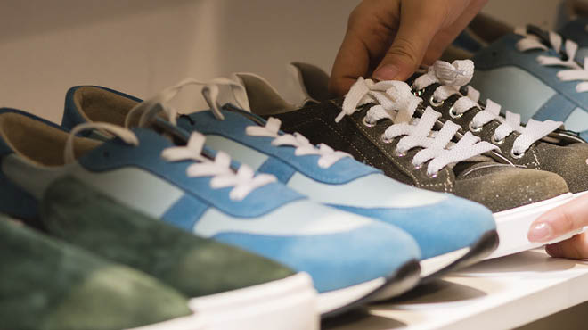 Shoes lined up on shelf