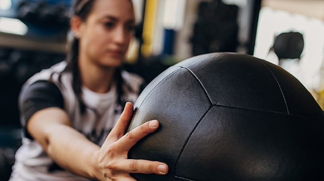 Athlete using medicine ball