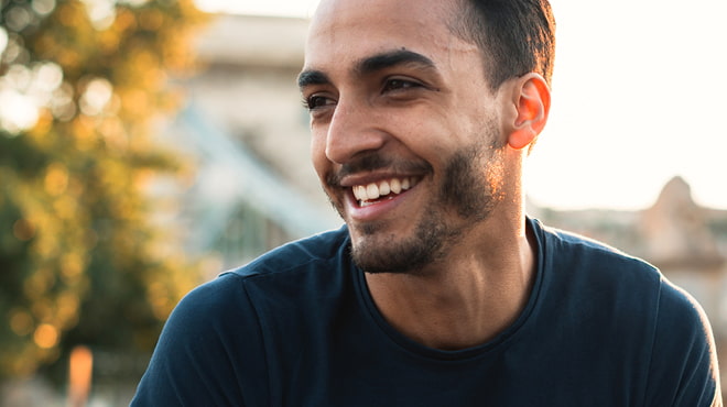 Bearded person smiling