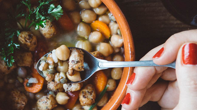 Spoonful of soup with chickpeas