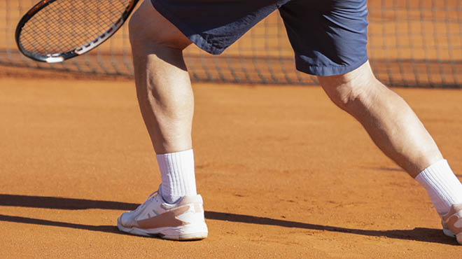 Close-up of legs of person playing tennis