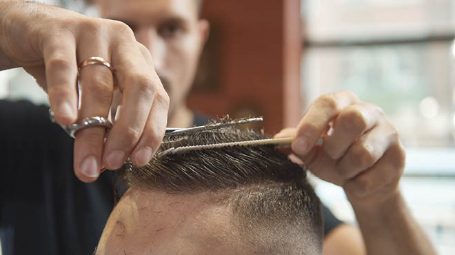 Giving a haircut closeup