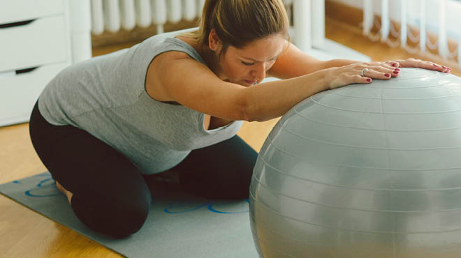 Pregnant using stability ball