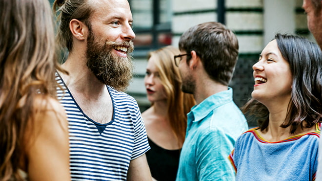 Two people laughing in group