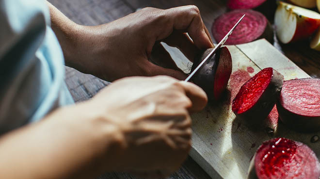 Using knife on cutting board