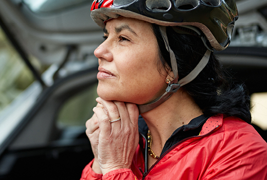 Person putting a helmet on