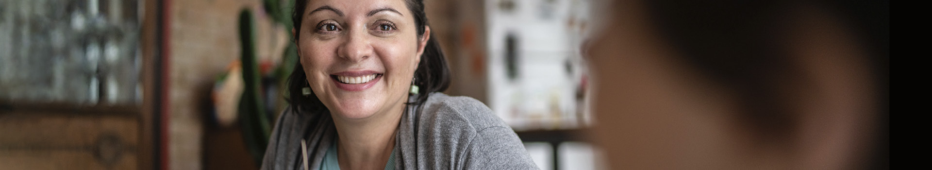 Person looking down and smiling