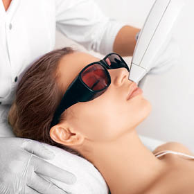 Lady laying in spa with glasses on