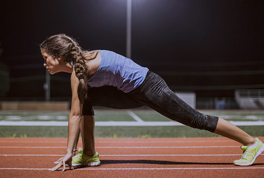 Person on track in start position